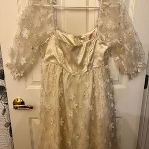 Elegant Cream Dress with Floral Details